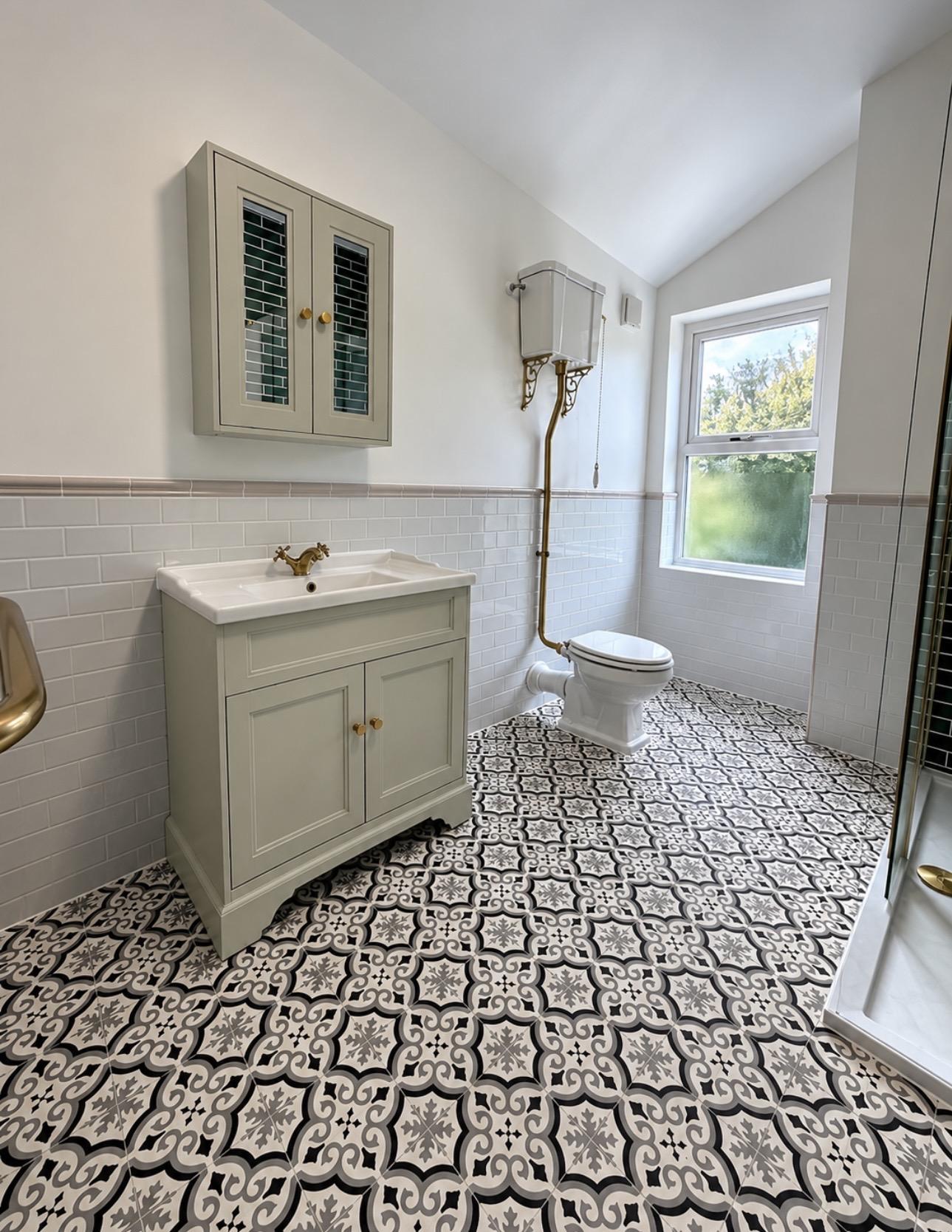 Traditional grey vanity, high-level WC and patterned monochrome floor in a bathroom renovation in B67 by M3 Trades